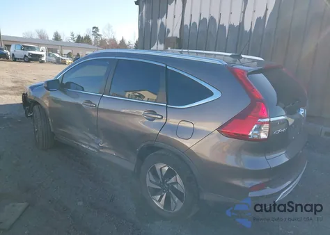 2015 Honda Cr-V Touring z USA, uszkodzony, nr VIN 5J6RM4H90FL090130